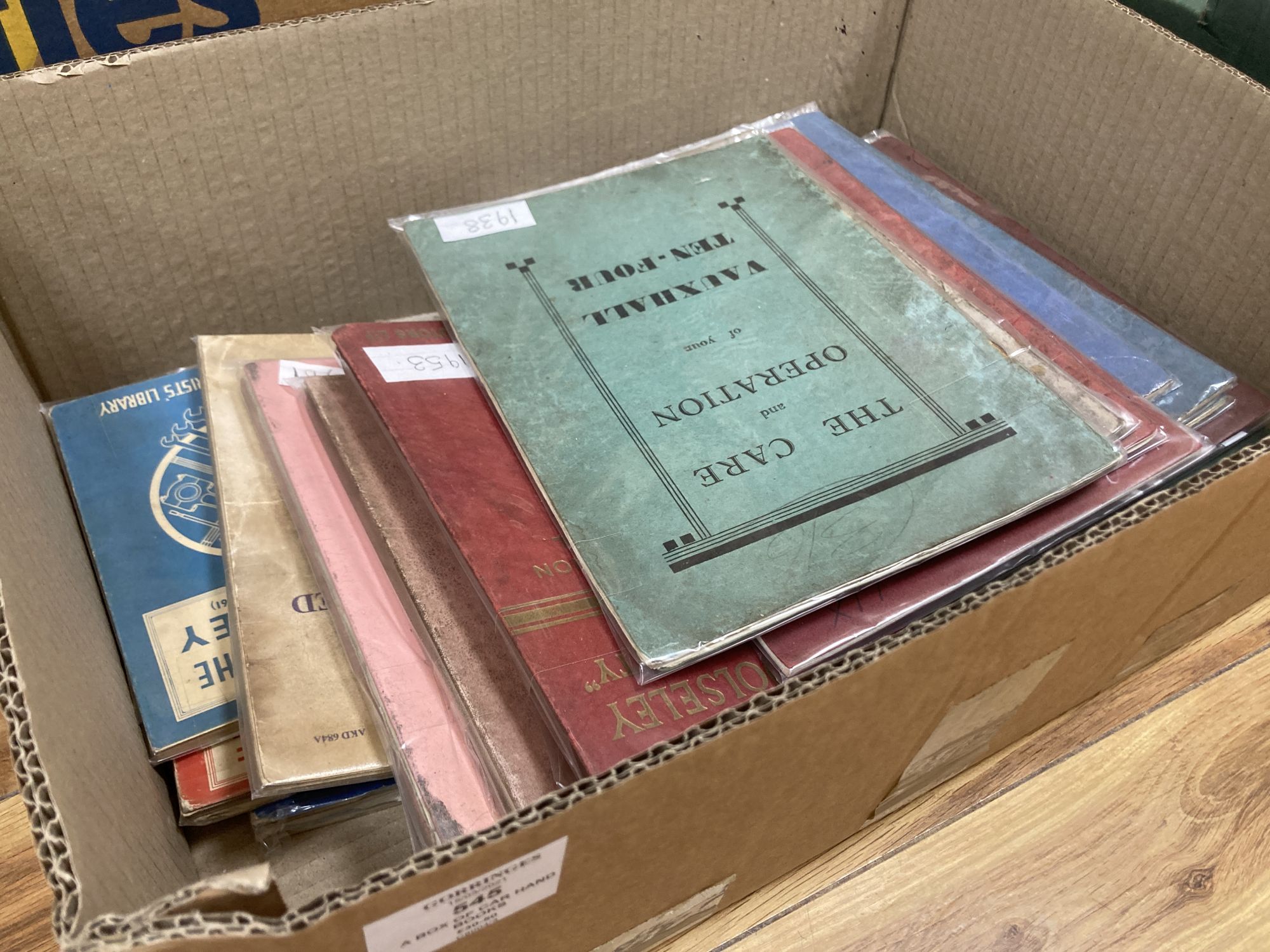 A box of car hand books